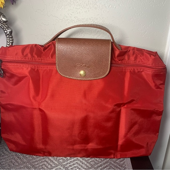Longchamp Red and Brown Clutch with Sophisticated Design